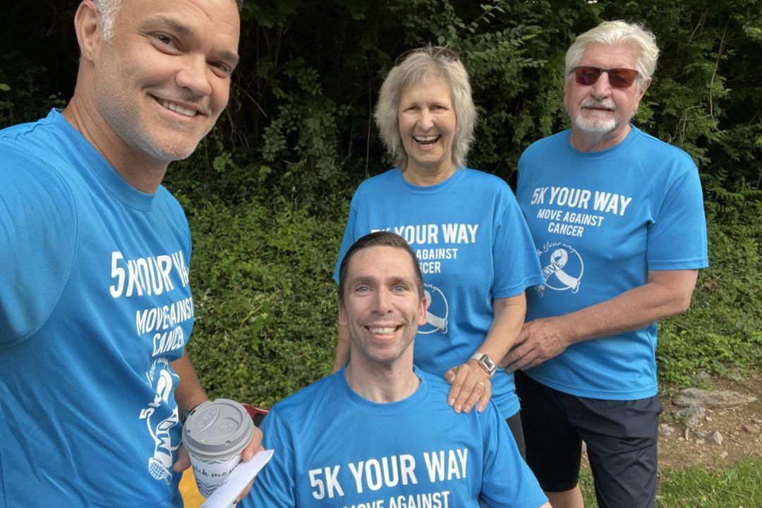 A group of 5K Your Way participants are grouped together smiling
