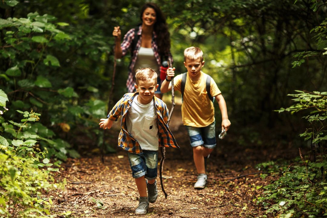 A mother and 2 children are enjoying spending time outdoors in the UK with trundl the walking for charity app