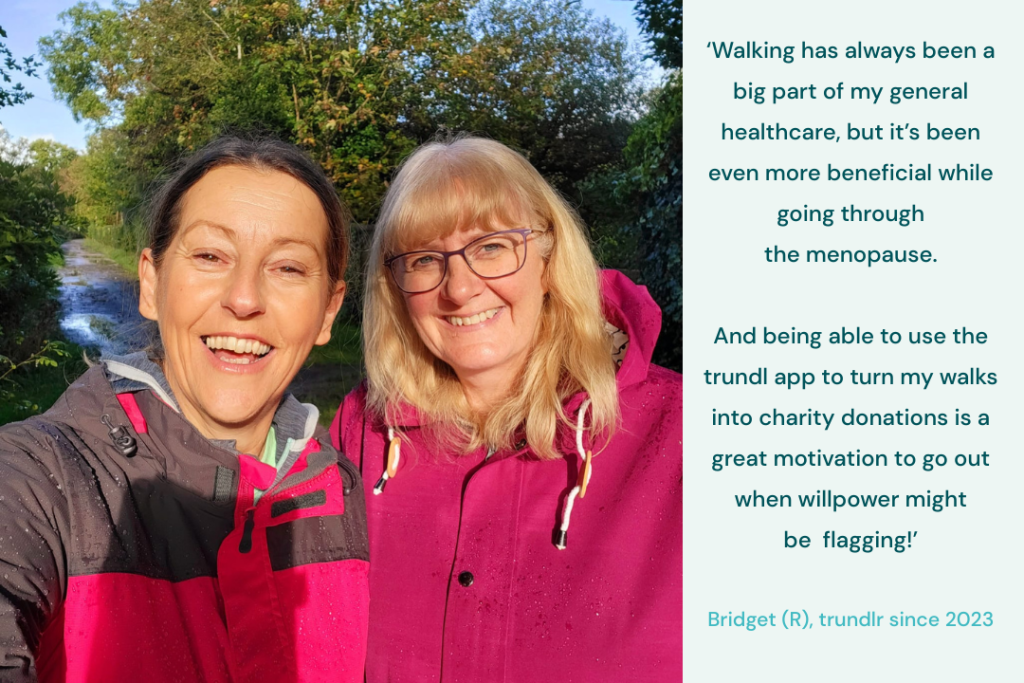 Walking for charity app trundl member Bridget smiles with a friend while she explains why walking is good for health and why the trundl app provides the motivation to go walking regularly