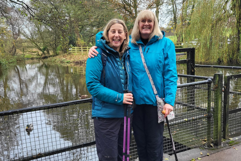 Walking for charity app founder Hil Mines and trundl member Bridget smile as they discuss how walking helps during the menopause