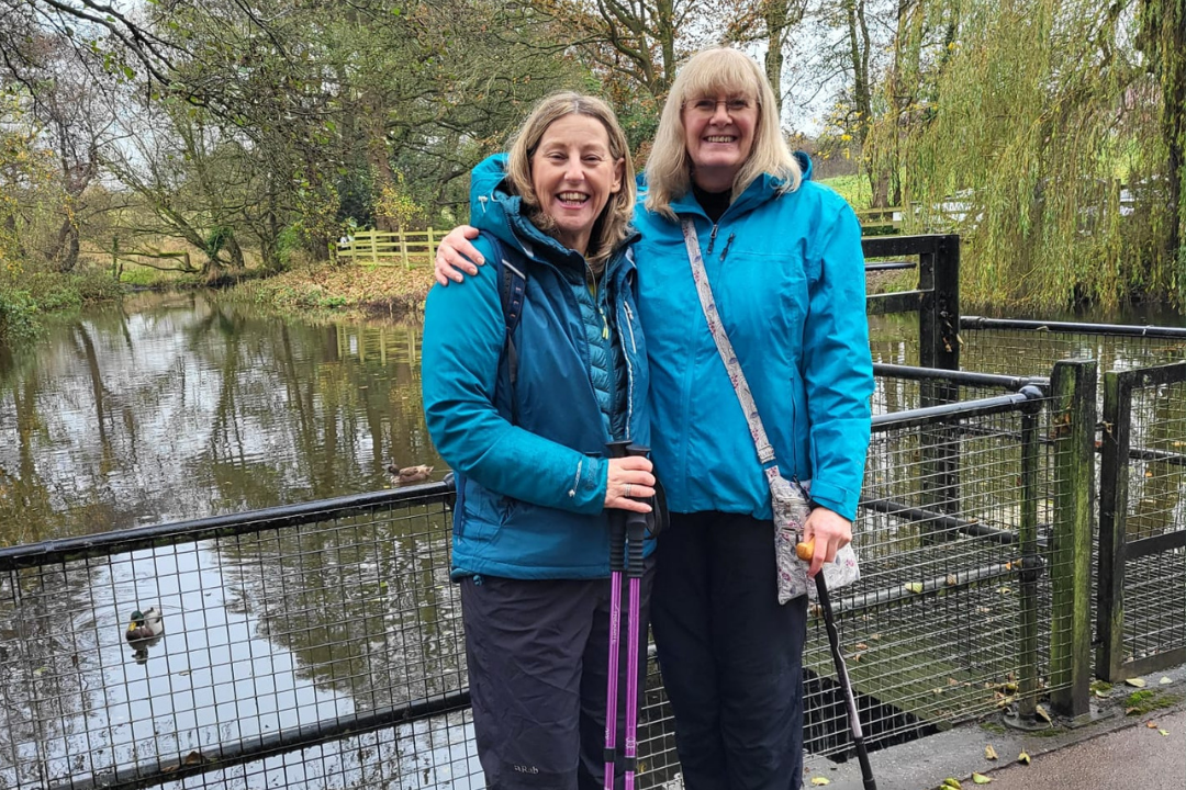 Walking for charity app founder Hil Mines and trundl member Bridget smile as they discuss how walking helps during the menopause