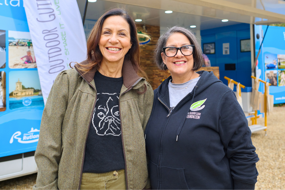 Julia and Gina Bradbury founders of The Outdoor Guide Foundation and partners with the trundl app stand smiling outdoors together