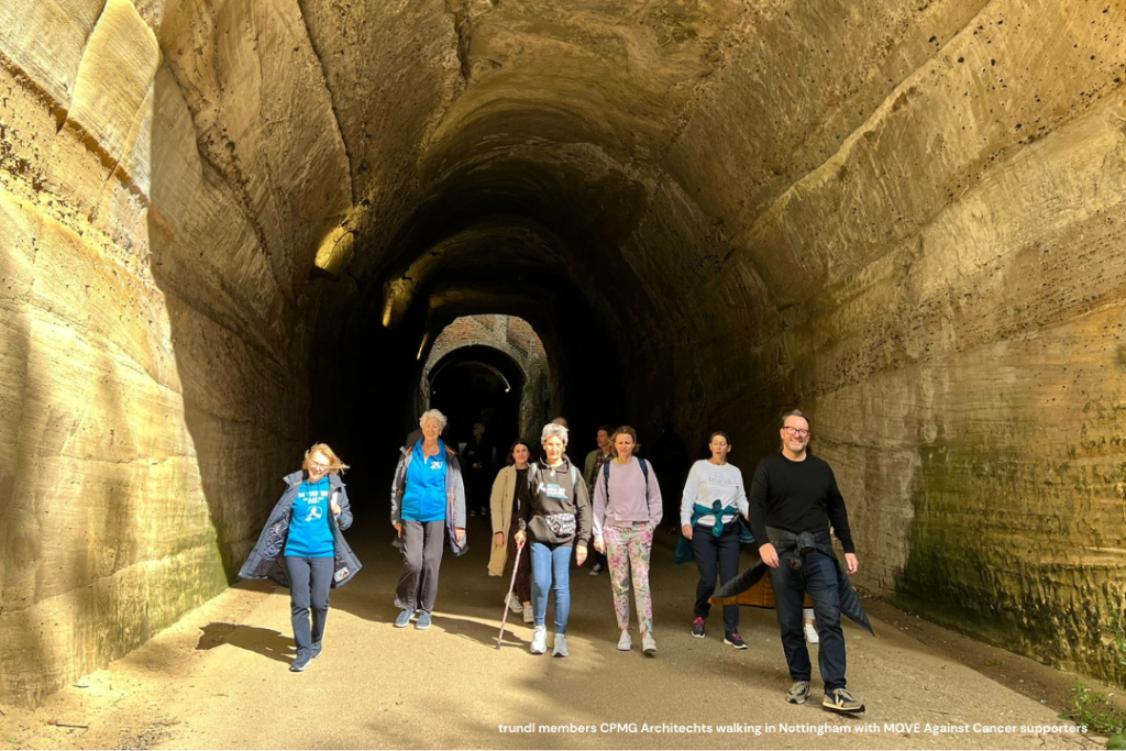 A number of people using the trundl app walk out of a tunnel into sunlight